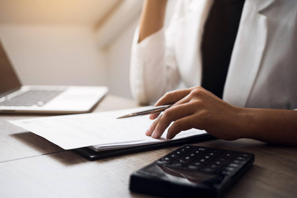 Personal injury lawyer calculating contingency fees for personal injury law
