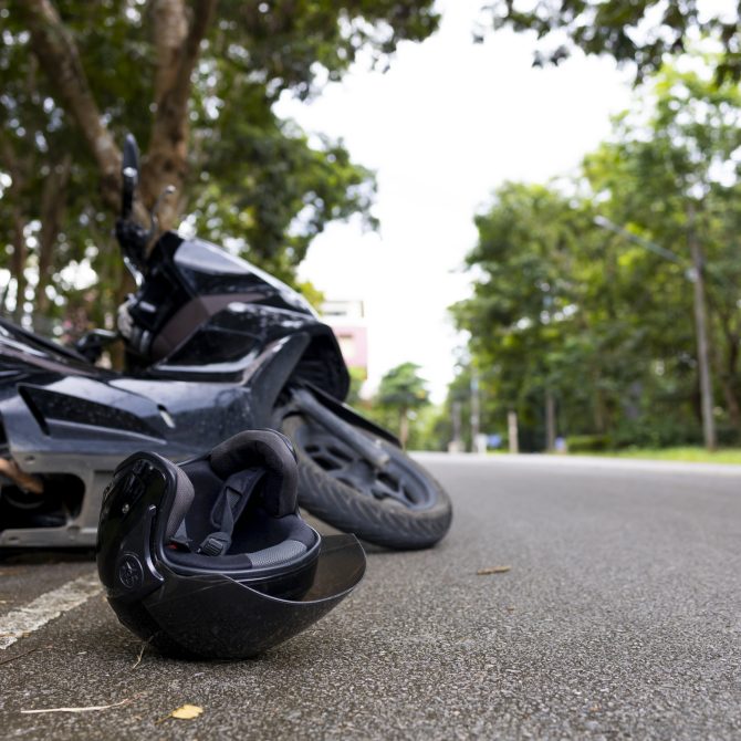Motorcycle accident with helmet on road and safety reminder Save Life message, concept of road safety and awareness