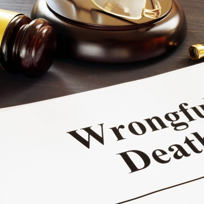 Wrongful Death report and gavel in a court.