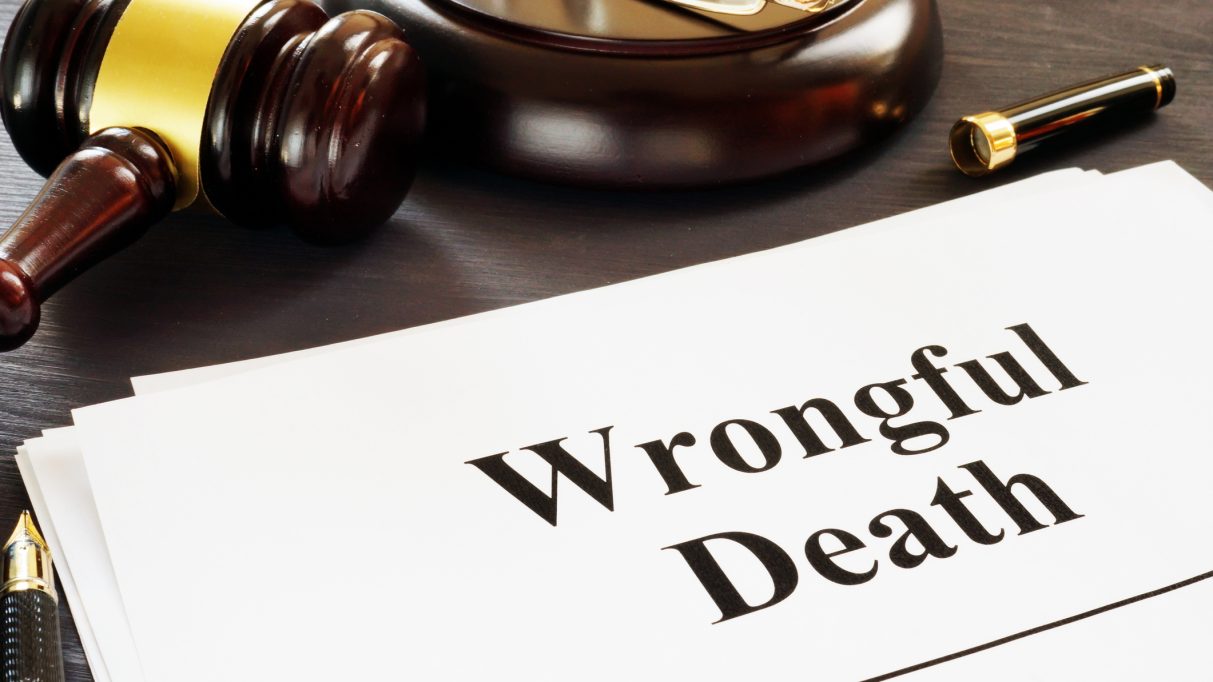 Wrongful Death report and gavel in a court.